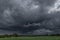 Dark, swirling, threatening clouds in the sky.