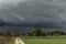 Dark, swirling, threatening clouds in the sky.