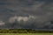 Dark, swirling, threatening clouds in the sky.