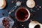 Dark table tea composition. Brown cup. Cold warm background