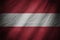 Dark textile background or texture with blending Austria flag