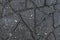 Dark texture of cracked asphalt, broken road surface