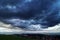 Dark thunderclouds over a small town