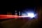 A dark tunnel with colorful light trails.