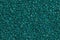 Dark turquoise shining background with glitter close-up.