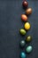 Dark vertical easter background with eggs colored with natural dye