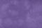 Dark violet matte background of suede fabric, closeup