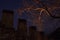 dark wall of the fortress in the city of the Alanya, Turkey. serfs wall night, over the towers fortress rises the tree branches