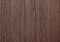 Dark walnut, polished flat surface of natural dark wood close-up. Background, texture