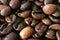 Dark whole coffee beans background