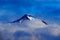 Dark winter mountain with snow in the clouds, blue landscape, Svalbard, Norway