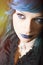 Dark woman with blue hair and lipstick. Key pendant. Dark girl