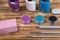 On a dark wooden background, manicure items, rhinestones for nails, multi-colored varnishes, nail file and brushes, for easy