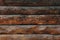 Dark wooden fence. Shabby table, dirty pine lumber. Old wood boards