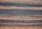 Dark zebrano oak, natural stripe pattern on a flat, polished wood surface