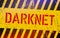 Darknet on warning sign. Grungy style. Cyber crime concept. Dark side of internet.