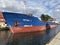 Darlowko, Poland: Cargo ship leaving the port on a summer day