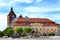 Darlowo, Poland - Historic quarter and market square with medieval St. Mary\\\'s Church, city hall and Fountain - Fisherman Memorial