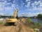 Darlowo, Poland, June 12 2021: Building anti flood sand barrier on the Wieprza river