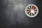 Dart arrow hitting in bullseye on dartboard with black