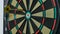 A dart arrow stick on the dart board.