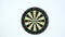 A dart strikes the bulls-eye of a dartboard
