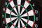 Dartboard isolated on a wooden background.Darts game.Successful game.National English game. Target on a wooden