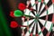 Darts in bulls-eye close up, purpose concept