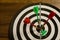 Darts, green and red, embroidered in the center of the dart board, Business concept, Teamwork and target reaching the same goal