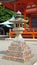 Daruma Doll on Lantern of Katsuoji temple in Japan