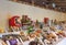 Daruma hariko doll and Japanese food or drinks lined up in Meiji JingÅ« Shrine.