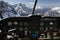 Dashboard in airplane cockpit and mountains view