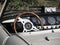 Dashboard of an old british classic car . Particular view of steering wheel and vehicle instrument pane