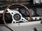 Dashboard of an old british classic car. Particular view of steering wheel and vehicle instrument panel . The car is a Triumph TR