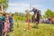 A dashing Cossack knocks down the sword of a bottle of water on a horse