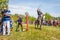 A dashing Cossack knocks down the sword of a bottle of water on a horse