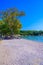 Dassia Beach with crystal clear azure water in beautiful landscape scnery - paradise coastline of Corfu island, Ionian archipelago