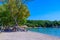 Dassia Beach with crystal clear azure water in beautiful landscape scnery - paradise coastline of Corfu island, Ionian archipelago