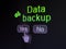Data concept: Gears icon and Data Backup on digital computer screen