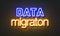 Data migration neon sign on brick wall background.