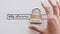 Data protection online, hand placing key and lock with Security label on whiteboard with website url bar