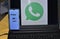 Data security and protection and privacy settings in India on screen of a white Android smartphone, logo and icon of WhatsApp from