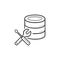 Database with wrench and screwdriver hand drawn outline doodle icon.
