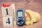 Date of 14 November, glucose meter and fruits, world diabetes day concept