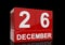 The date of 26 December in white numbers and letters on red, glossy blocks