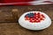 Date blocks and fruitcake on wooden table with 4th july theme