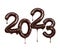 Date of the New Year 2023 made of melted dark chocolate