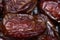 Date palm on a traditional craftsman market.Horizontal image. Dried fruits dates