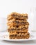 Date squares or Matrimonial cake stacked on a plate in a white kitchen