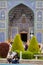 Date of young Iranian couple near mosque, Isfahan, Iran.